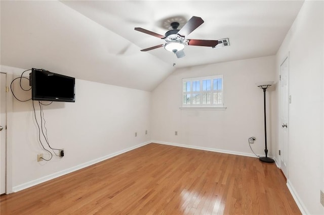 additional living space featuring ceiling fan, lofted ceiling, and light hardwood / wood-style floors