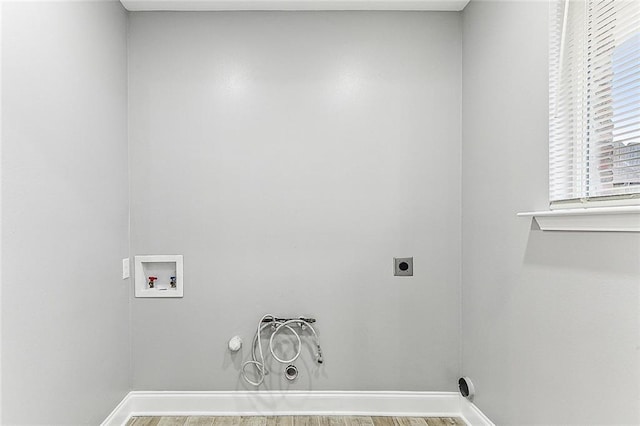 laundry room featuring hardwood / wood-style flooring, washer hookup, hookup for a gas dryer, and electric dryer hookup