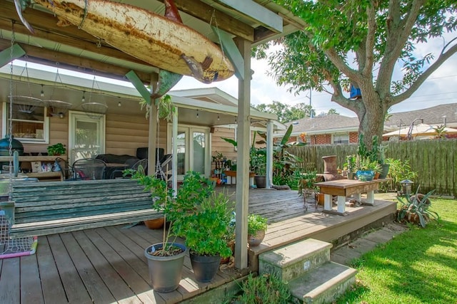 wooden deck featuring fence