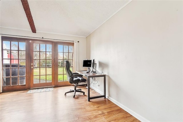 office area featuring vaulted ceiling with beams, a textured ceiling, and light wood-type flooring