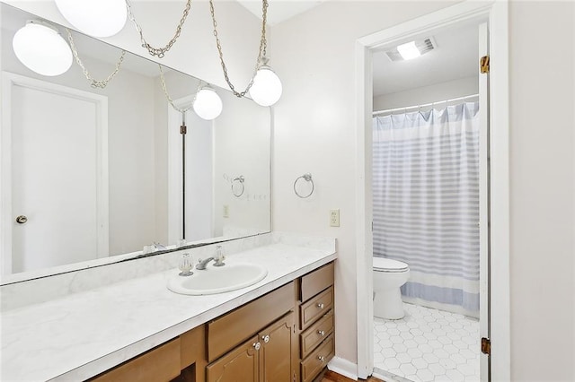 bathroom with vanity and toilet