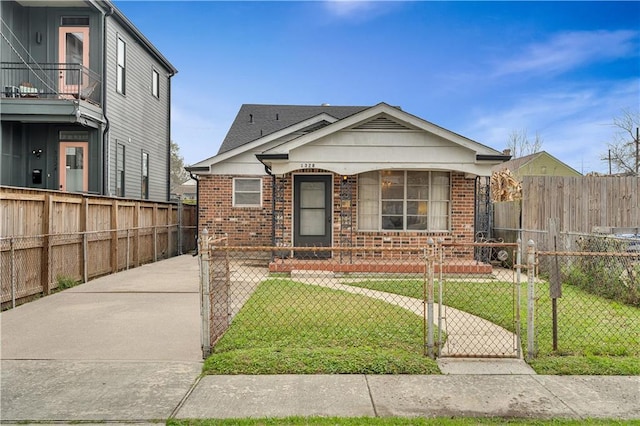 1328 Clouet St, New Orleans, LA 70117 - view of front of house with brick siding and a gate