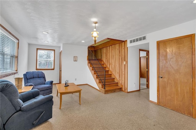 1328 Clouet St, New Orleans, LA 70117 - living room with stairs, baseboards, and recessed lighting