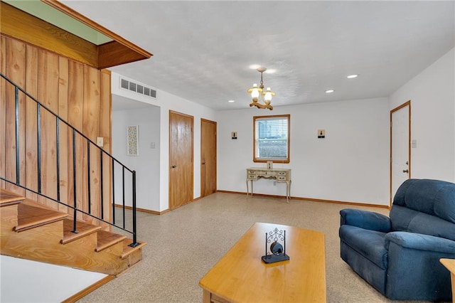 1328 Clouet St, New Orleans, LA 70117 - living room featuring stairway, a chandelier, baseboards, and recessed lighting