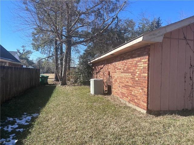 view of yard featuring central air condition unit