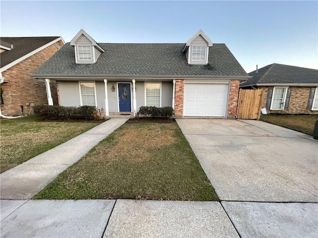 view of front of property with a garage and a front yard