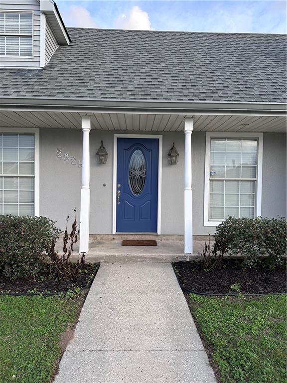 view of exterior entry featuring a porch