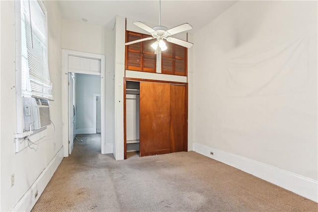 interior space featuring carpet, cooling unit, and a closet