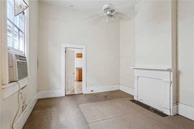 unfurnished living room with cooling unit and ceiling fan