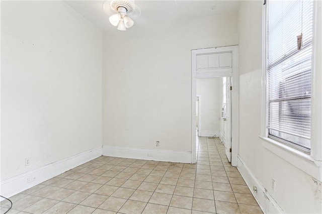 unfurnished room featuring light tile patterned floors