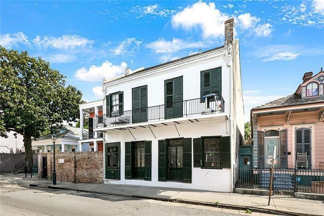 back of house with a balcony