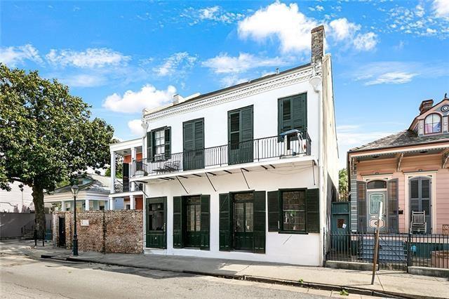 1224 Bourbon St Unit 1, New Orleans, LA 70116 - view of front of property featuring a balcony and stucco siding