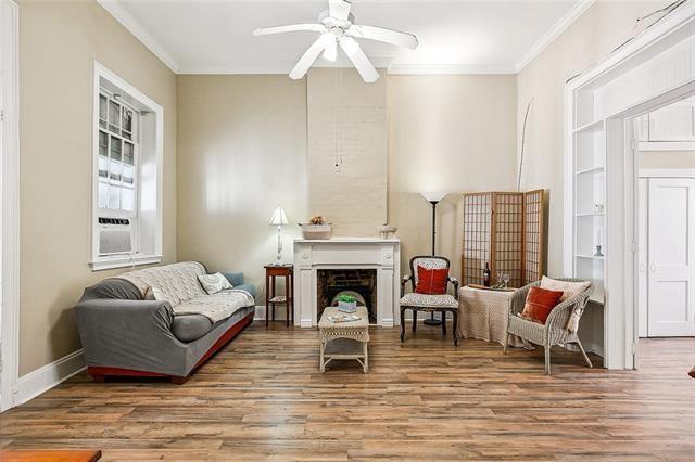 1224 Bourbon St Unit 1, New Orleans, LA 70116 - sitting room with crown molding, a ceiling fan, wood finished floors, and baseboards