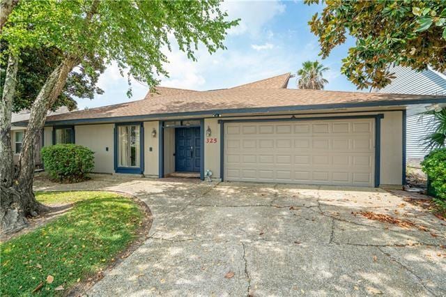 ranch-style house featuring a garage