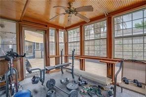 workout area with wooden ceiling and ceiling fan