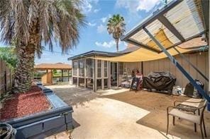 view of patio with a sunroom