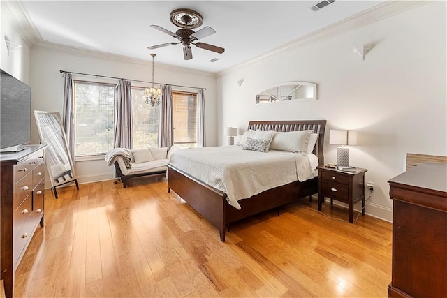 bedroom featuring crown molding, ceiling fan with notable chandelier, and light hardwood / wood-style flooring