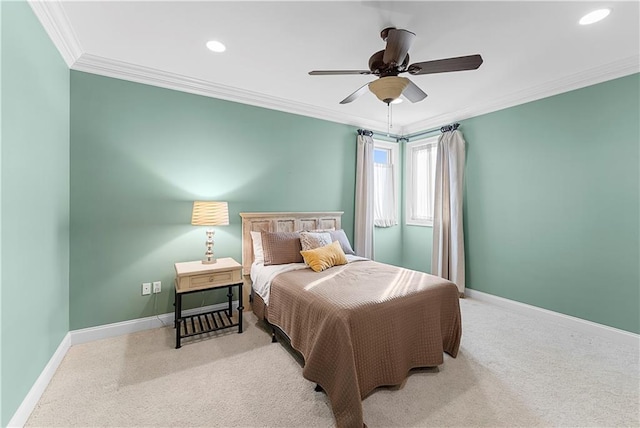 carpeted bedroom featuring crown molding and ceiling fan