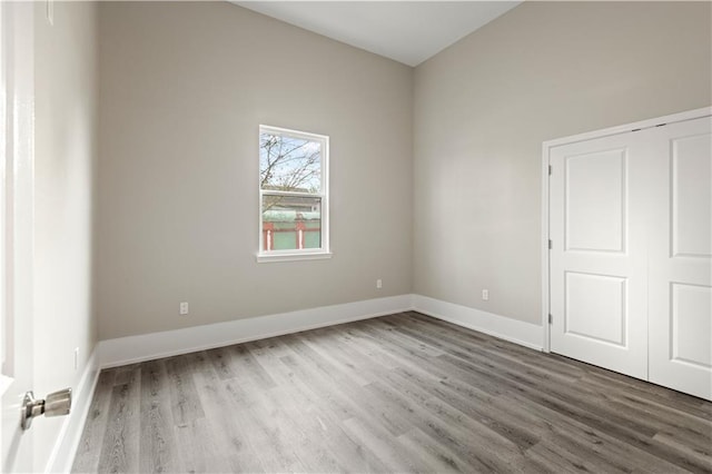 spare room featuring hardwood / wood-style floors