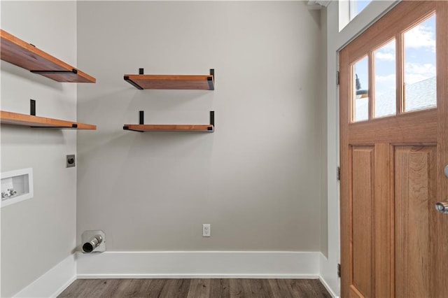 clothes washing area with hookup for an electric dryer, washer hookup, and dark hardwood / wood-style floors