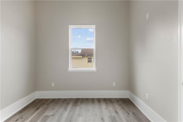 spare room with light hardwood / wood-style floors