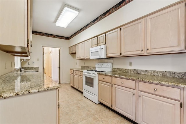 kitchen featuring sink, light tile patterned floors, light stone counters, light brown cabinets, and white appliances