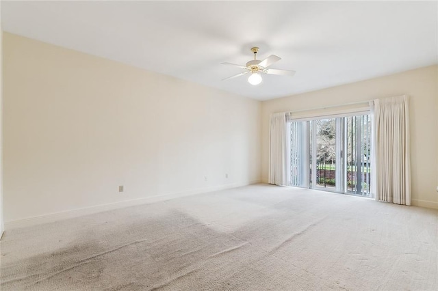 unfurnished room featuring light carpet and ceiling fan