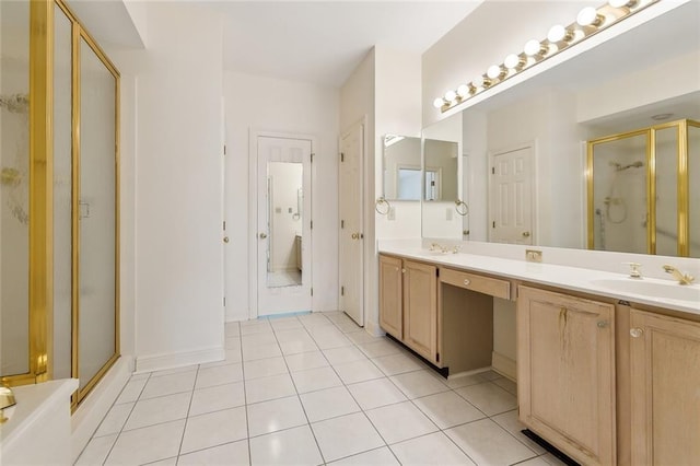 bathroom with vanity, tile patterned floors, and walk in shower