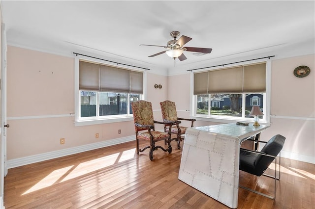 interior space with hardwood / wood-style floors and ceiling fan