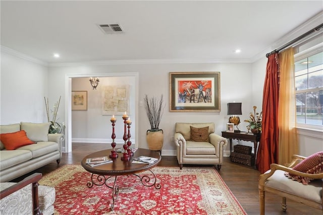 sitting room featuring ornamental molding and dark hardwood / wood-style floors