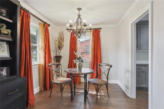 dining area featuring an inviting chandelier, ornamental molding, and dark hardwood / wood-style floors