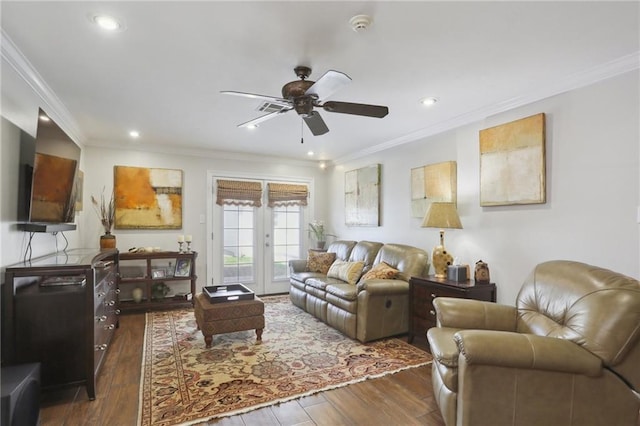 living room with crown molding, dark wood-type flooring, and ceiling fan