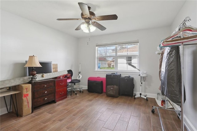 office featuring ceiling fan and light hardwood / wood-style flooring