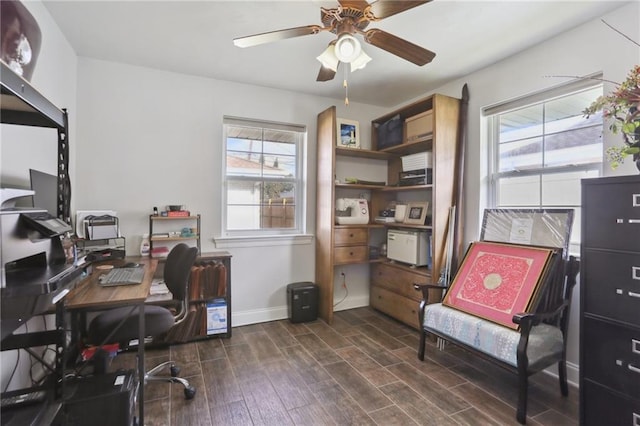 office with dark wood-type flooring and ceiling fan