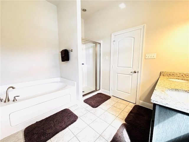 bathroom with vanity, tile patterned floors, and separate shower and tub