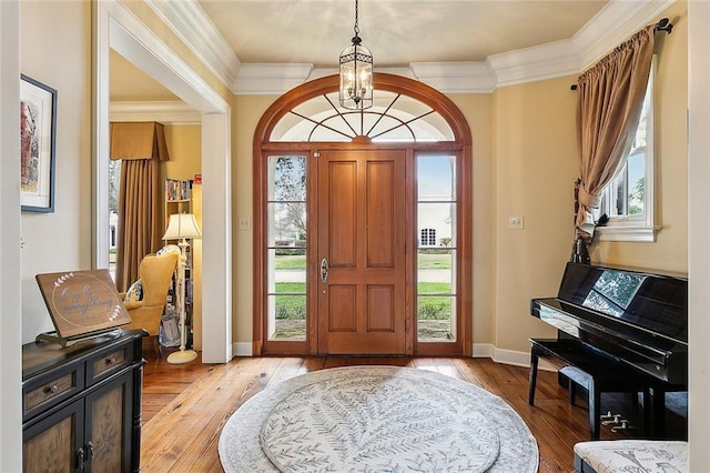 170 English Turn Dr, New Orleans, LA 70131 - foyer with ornamental molding, an inviting chandelier, and light hardwood / wood-style floors