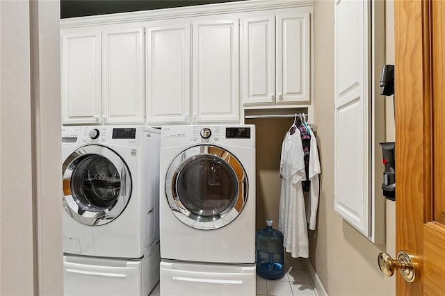 170 English Turn Dr, New Orleans, LA 70131 - laundry area with cabinets, tile patterned flooring, and washing machine and dryer