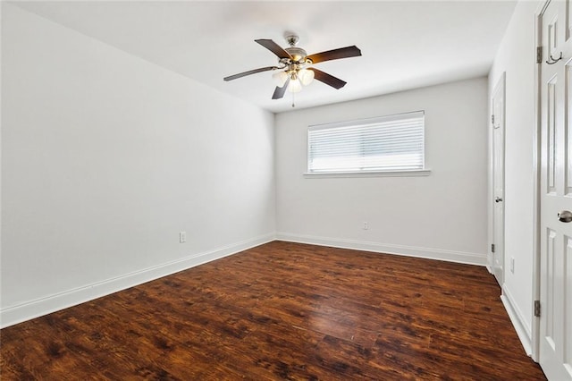 3512 James Dr, Metairie, LA 70003 - unfurnished bedroom with baseboards, a ceiling fan, and dark wood-style flooring