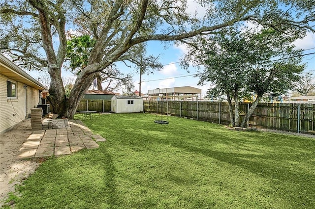 3512 James Dr, Metairie, LA 70003 - view of yard featuring a storage shed, a patio area, central AC, an outdoor structure, and a fenced backyard