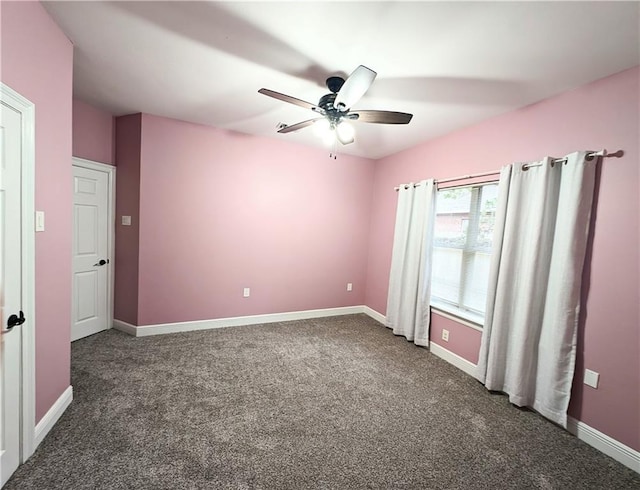 carpeted empty room featuring ceiling fan