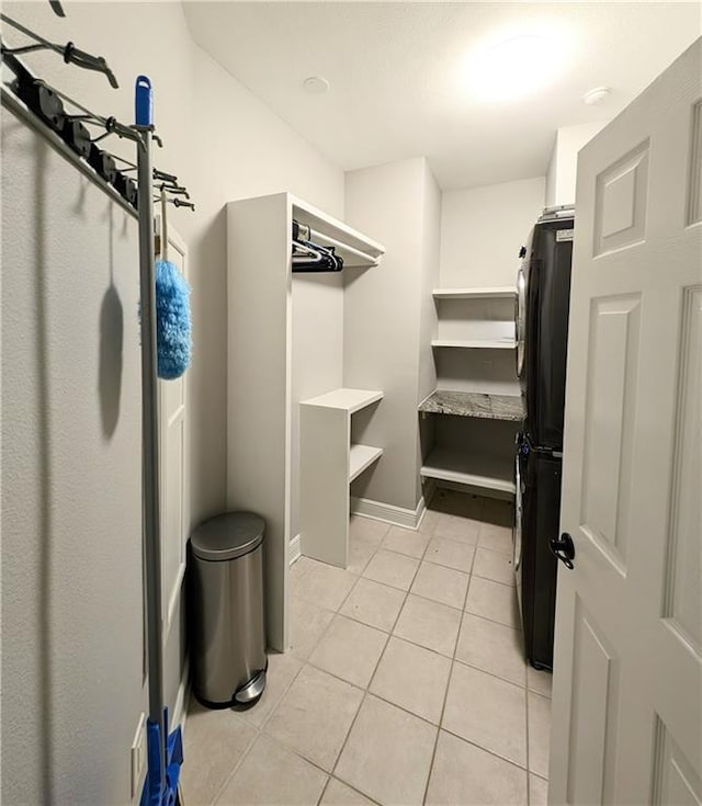 spacious closet featuring light tile patterned flooring