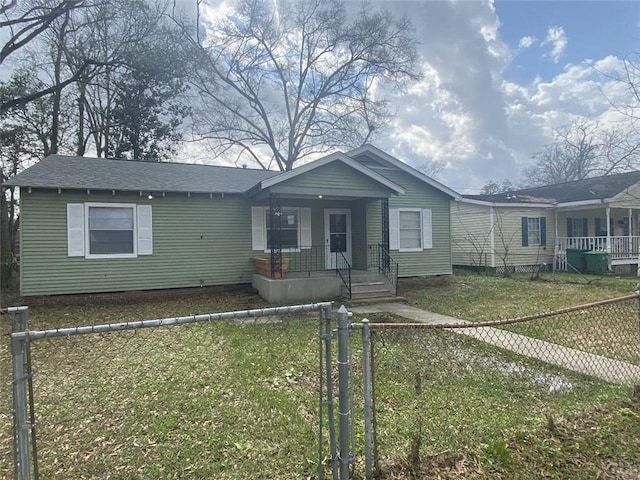 bungalow-style home with a front yard and covered porch