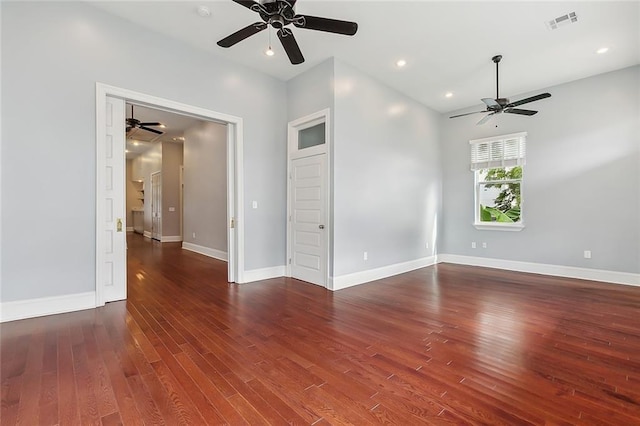 unfurnished room featuring dark wood-type flooring and ceiling fan