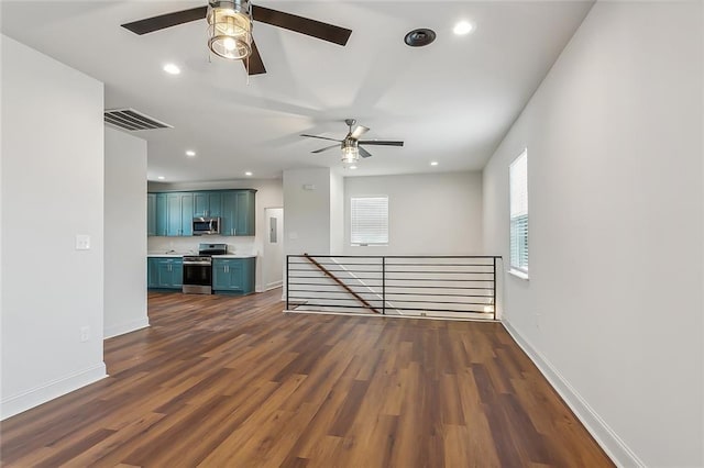 interior space with dark wood-type flooring, recessed lighting, baseboards, and visible vents