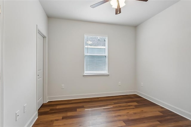 unfurnished room with a ceiling fan, baseboards, and wood finished floors