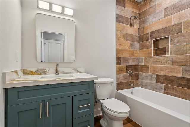 bathroom with vanity,  shower combination, and toilet