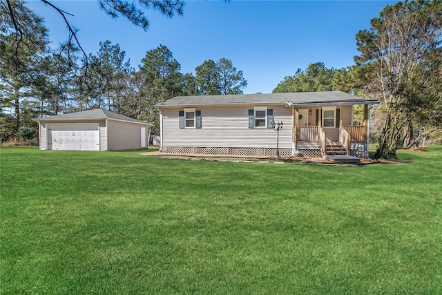 ranch-style home featuring a detached garage, an outdoor structure, a porch, and a front yard