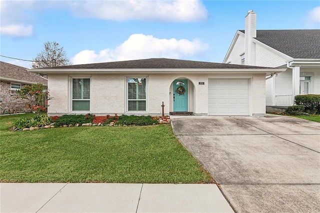 ranch-style home featuring a garage and a front yard