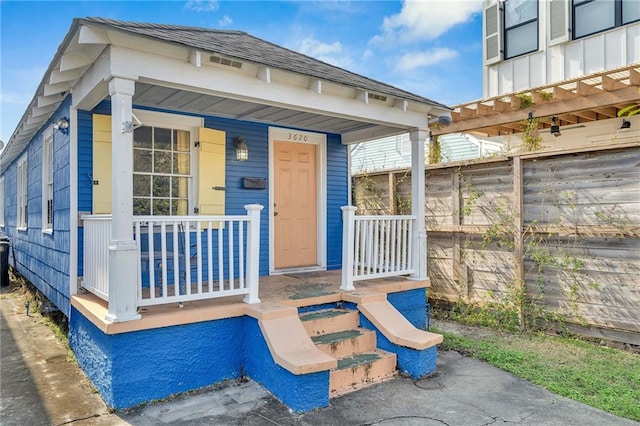 property entrance featuring covered porch