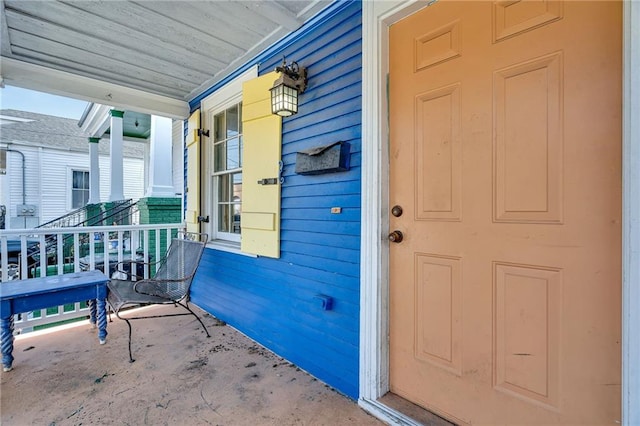 property entrance with a porch